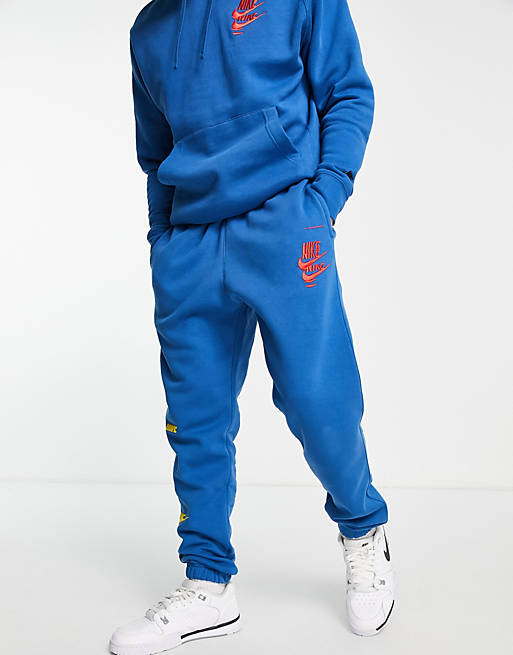 Nike Sport Essentials Multi Futura logo fleece joggers in marina blue | ASOS