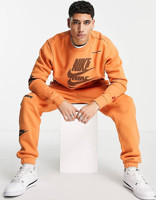 Nike Sport Essentials Multi Futura logo fleece sweatshirt in orange