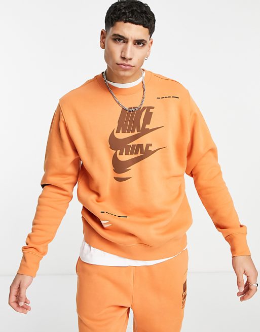 Nike Sport Essentials Multi Futura logo fleece sweatshirt in orange Nike Sport Essentials Multi Futura logo fleece sweatshirt in orange