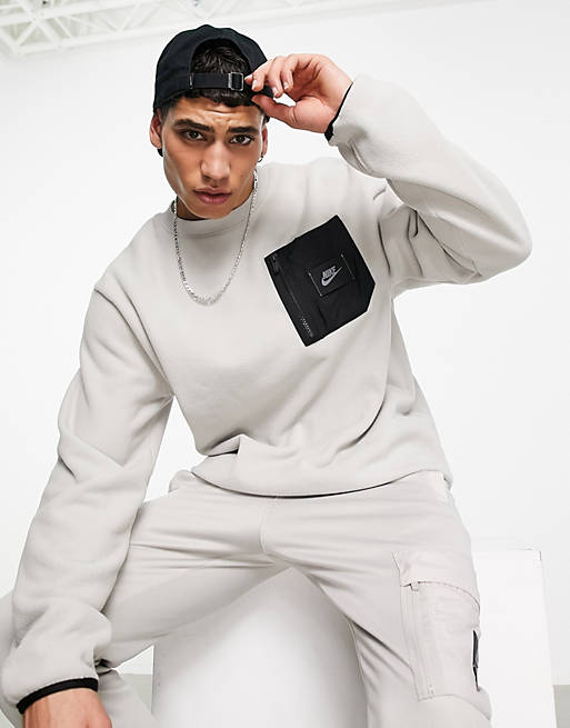Nike Sports Utility cargo pocket sweatshirt in light grey | ASOS