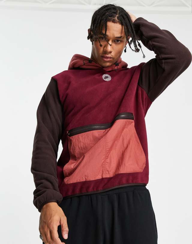 Nike Sports Utility hooded fleece in beetroot with contrast pocket and hood