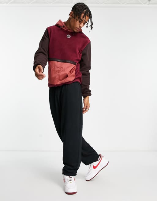 Nike Sports Utility hooded fleece in beetroot with contrast pocket