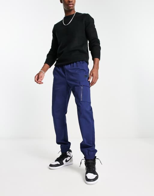 Nike cheap utility pantalon