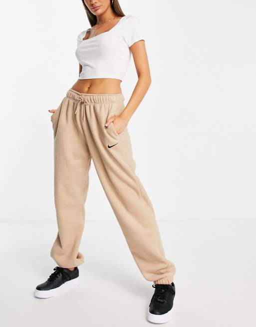 Nike high waisted wide leg sweatpants in black, ASOS