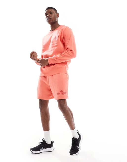 Nike Sportswear logo shorts in orange