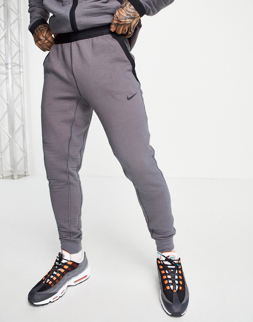 Nike Sportswear tech pack joggers in grey