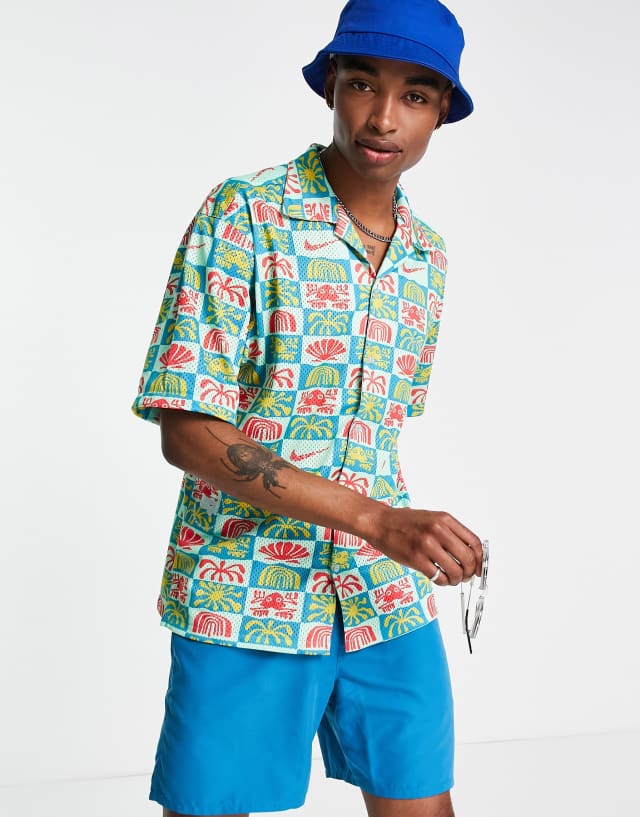 Nike Spring Break all over print revere collar shirt in blue