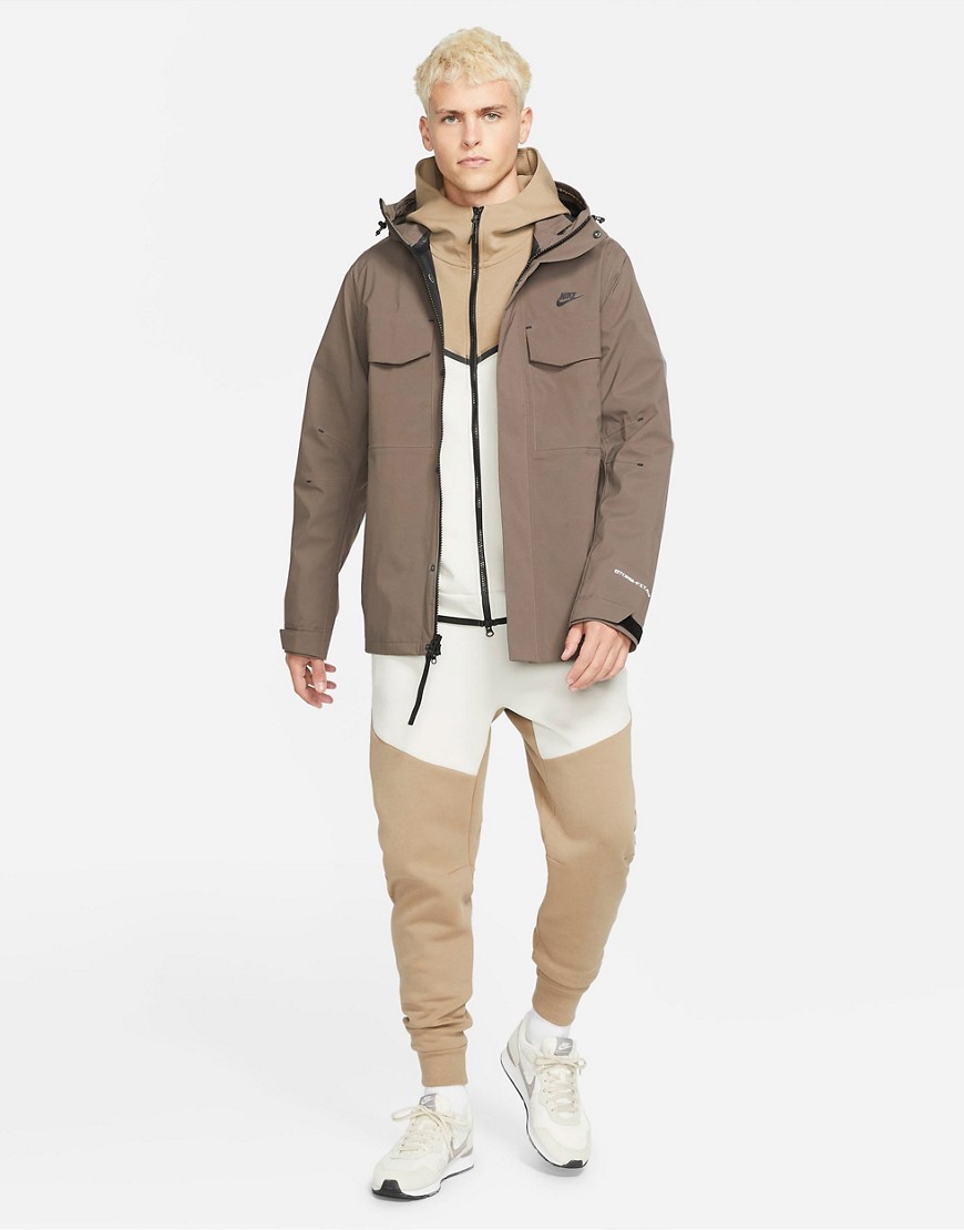 Nike StormFIT ADV M65 shell hooded jacket in ironstone-Brown