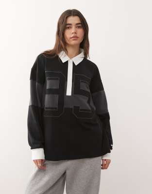 Nike - Street - Langärmliges Polohemd in Grau und Schwarz mit Grafik