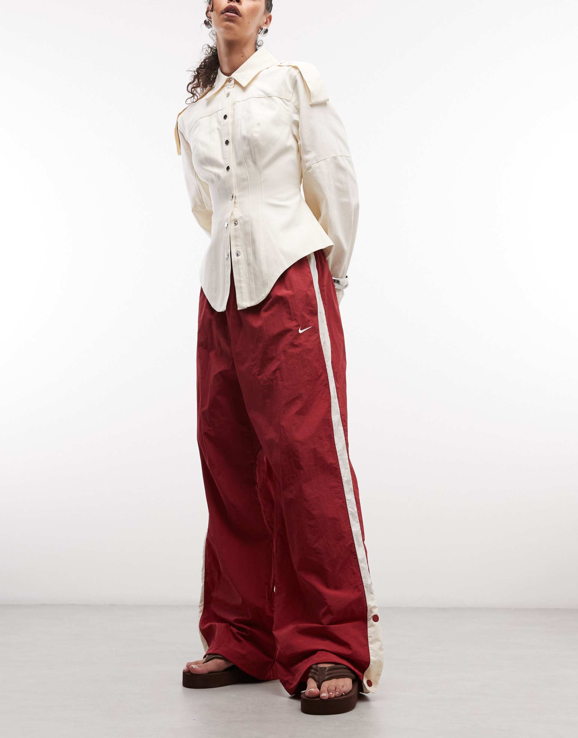 nike street parachute pants in red and off white