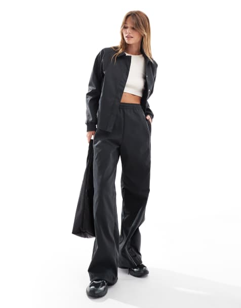 Nike Streetwear woven jacket and trousers in black - view 1