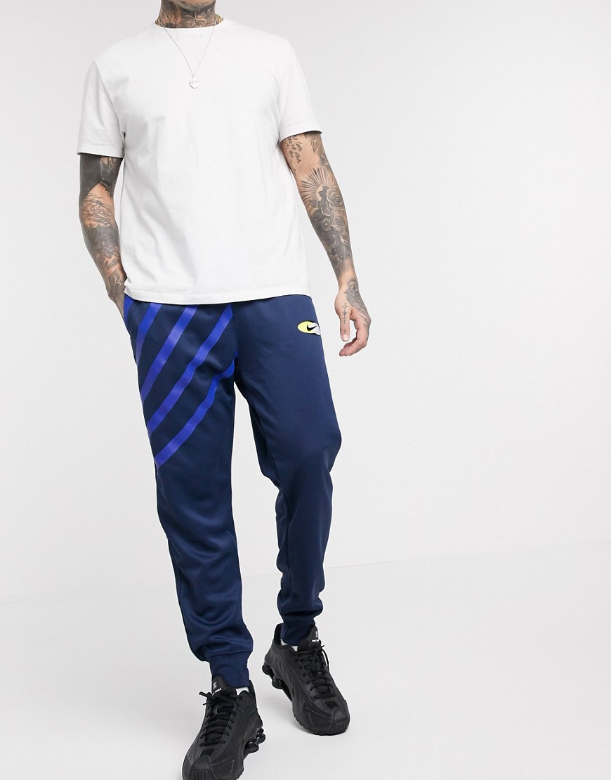 Nike — Subset — Marineblå joggingbukser med manchetter-Sort