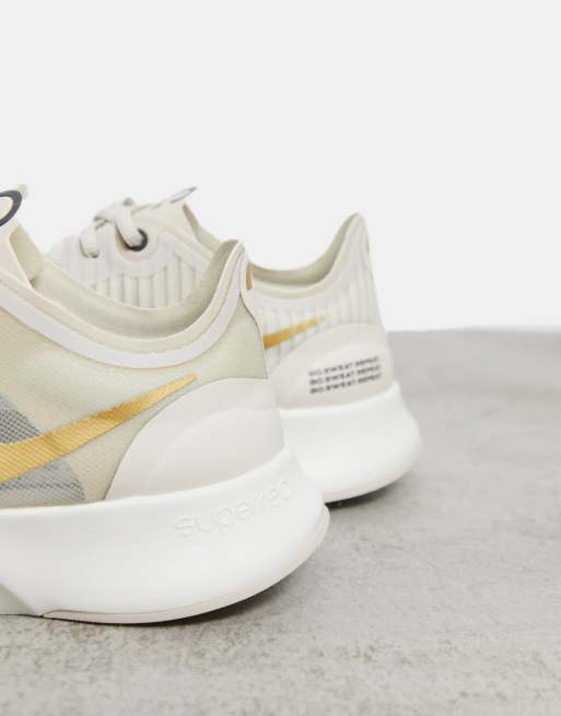 nike free 5.0 v4 womens gold