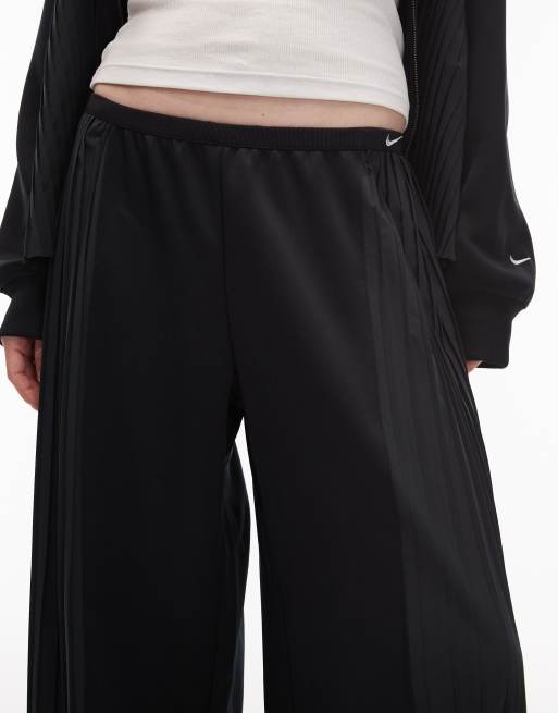 Nike – Svarta, plisserade byxor med vida ben, 5 av 5