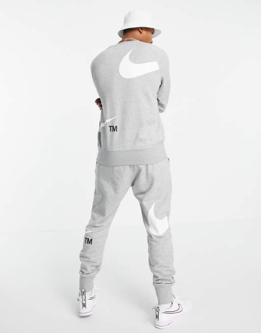 nike jogger en polaire à logo virgule gris