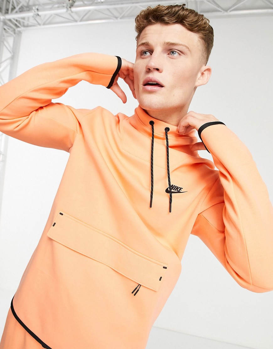 Nike - Sweater van tech fleece met opstaande boord in vaal oranje