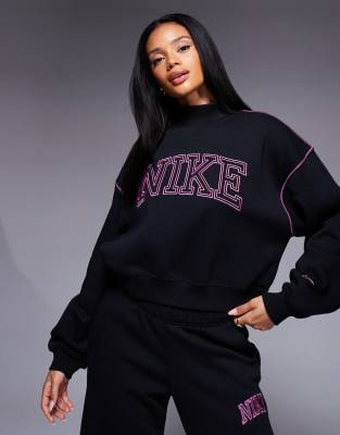 Nike - Sweatshirt in Schwarz und Rosa mit Retro-Logo und Stehkragen