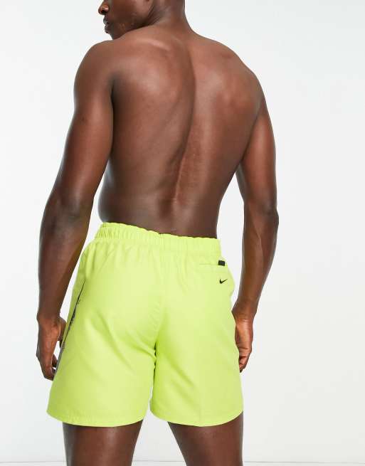 Nike large swoosh store shorts yellow