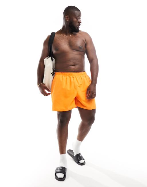 Nike Swimming Plus Essential 5 inch volley swim shorts in bright mandarin ASOS