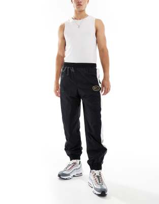 nike swoosh joggers black and white