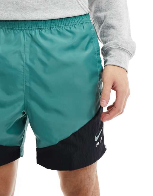 Nike Swoosh Air woven shorts in dark green ASOS