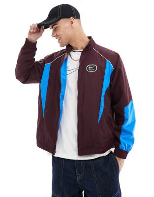 Nike Nike Swoosh Air woven tracktop in brown and blue