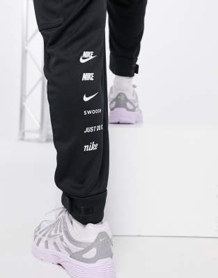 nike swoosh utility pocket joggers in black