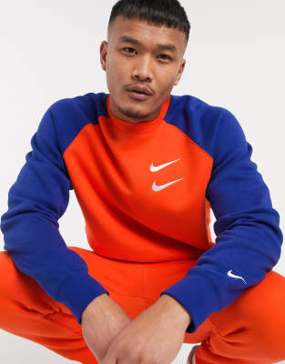 orange tracksuit nike