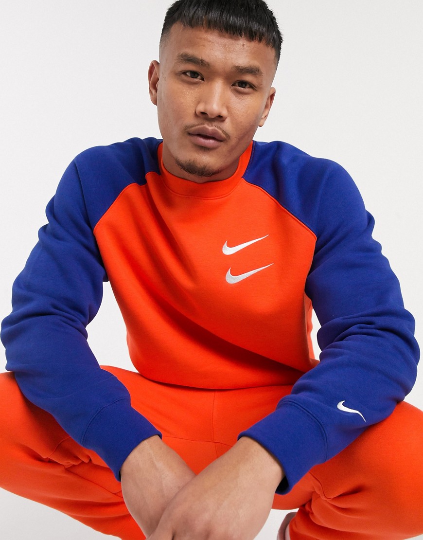 Nike Swoosh crew neck sweat in orange/blue