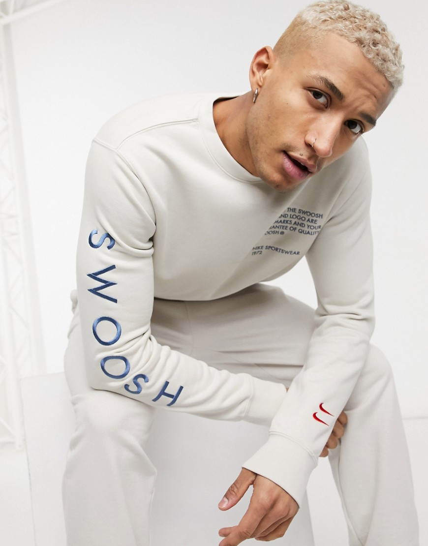 Nike Swoosh crew neck sweatshirt in off white-Brown