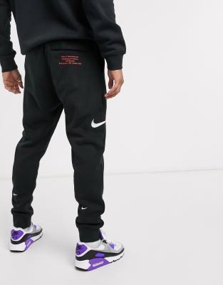 nike air sherpa utility cuffed joggers in black