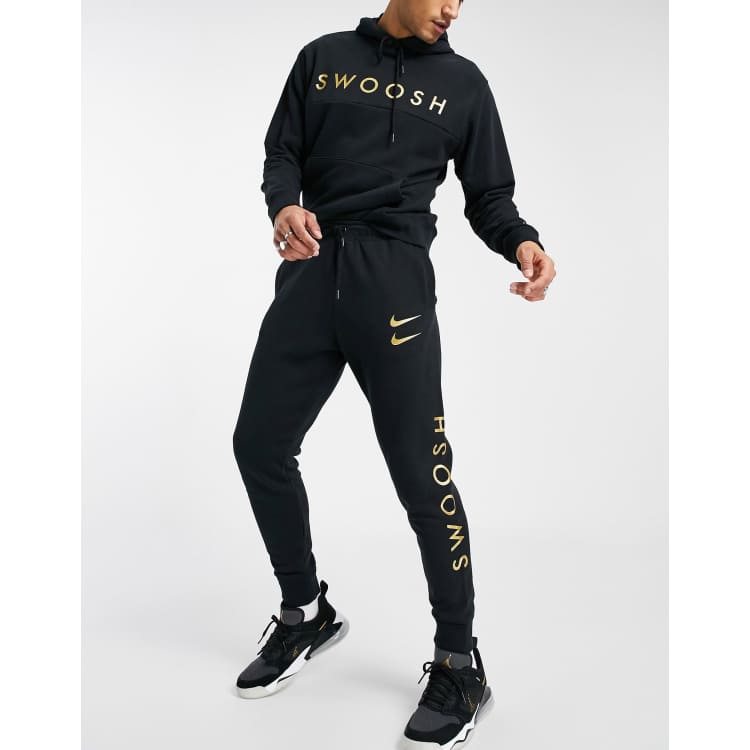 Black and 2025 gold nike tracksuit