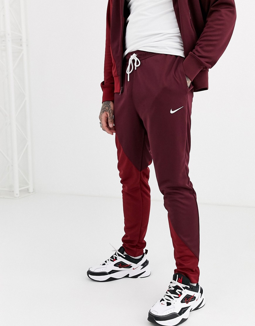 Nike Swoosh cuffed joggers in burgundy/red