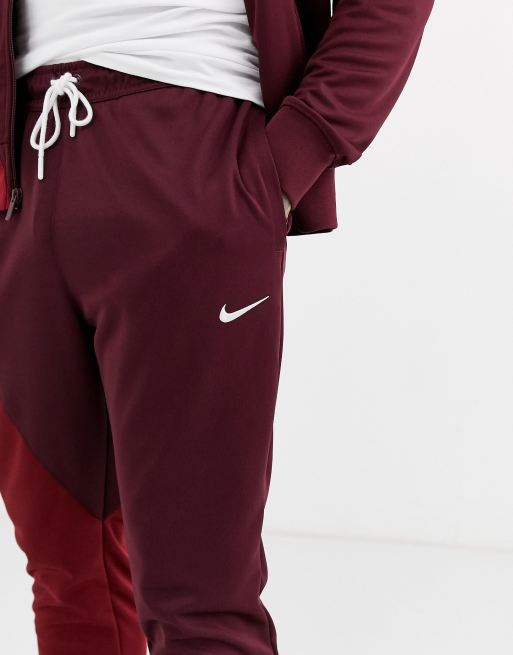 Red nike swoosh online joggers