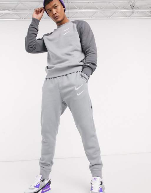 Nike Swoosh cuffed joggers in grey ASOS