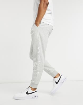 nike swoosh logo cuffed joggers in grey