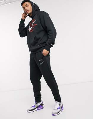 nike swoosh black joggers