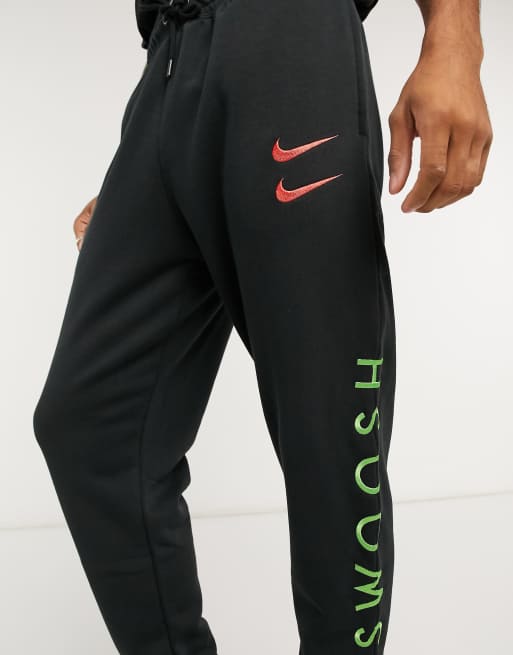 Nike swoosh cuffed 2024 sweatpants in black