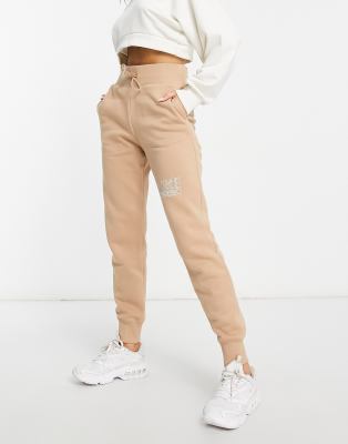 Nike swoosh best sale beige joggers