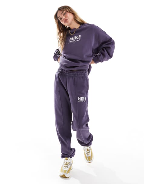 Nike Swoosh fleece joggers in dark purple - view 1