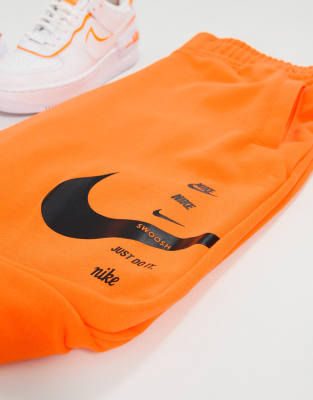 nike swoosh pants orange