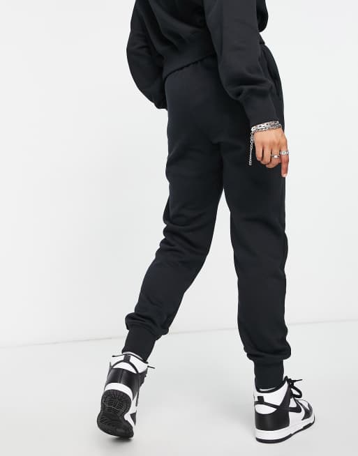 Nike Swoosh graphic joggers in black | ASOS