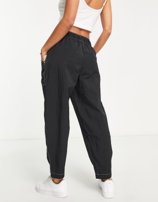 Nike Swoosh high-waisted woven pants in black