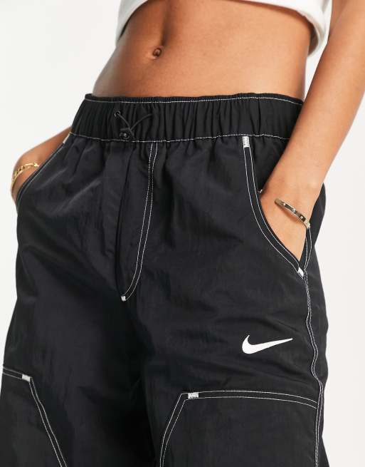 Nike Swoosh high-waisted woven pants in black | ASOS