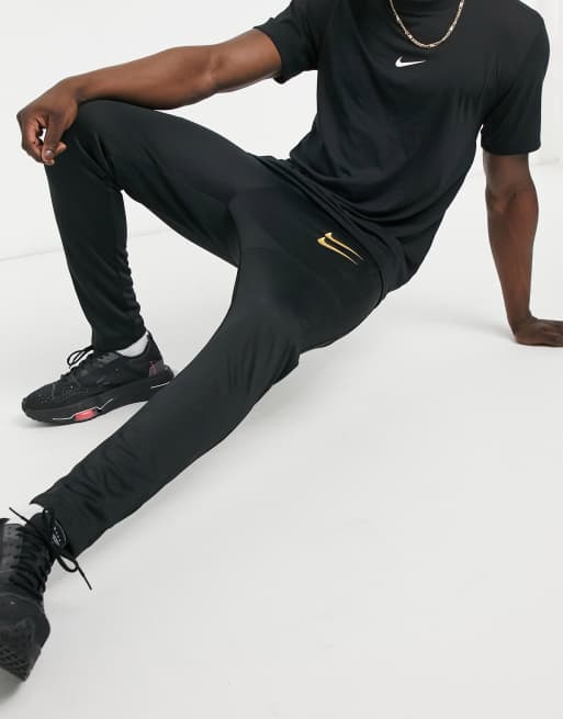 Nike swoosh joggers outlet black and gold