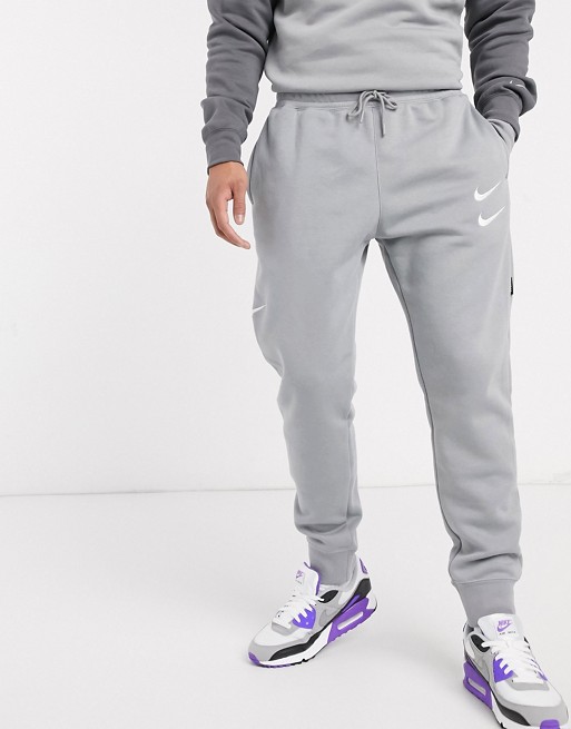 Nike Swoosh logo cuffed joggers in grey | ASOS