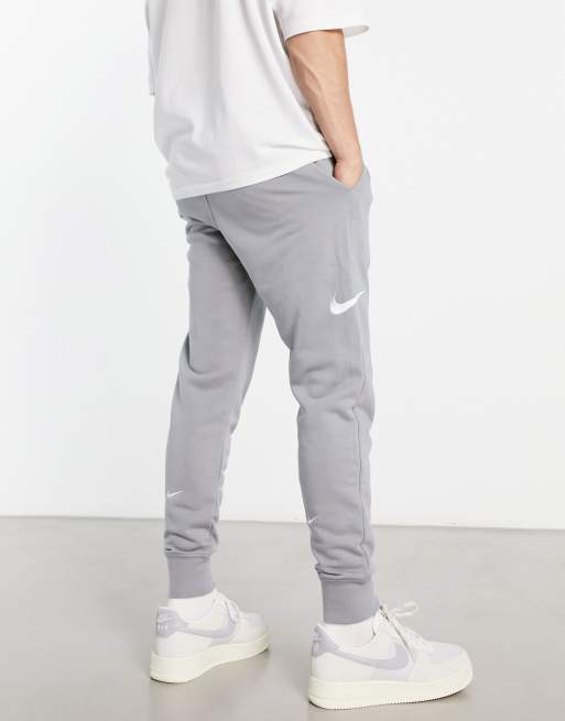 Nike Swoosh logo cuffed joggers in grey ASOS