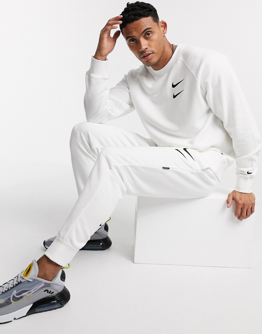 Nike Swoosh logo cuffed joggers in white