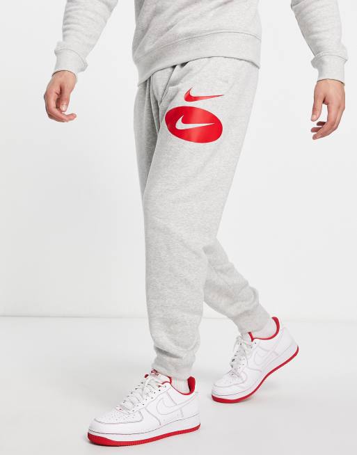 Nike Swoosh logo fleece joggers in grey ASOS