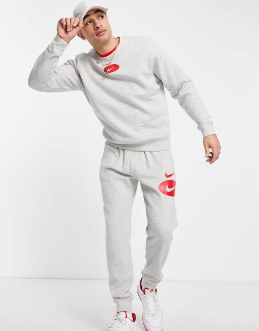 Nike swoosh best sale grey tracksuit